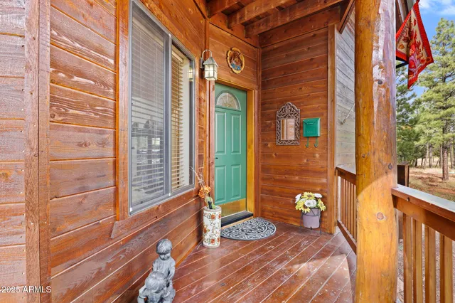 a view of a chairs and a table in the balcony