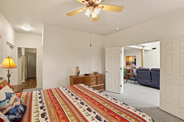 a bedroom with furniture and a chandelier