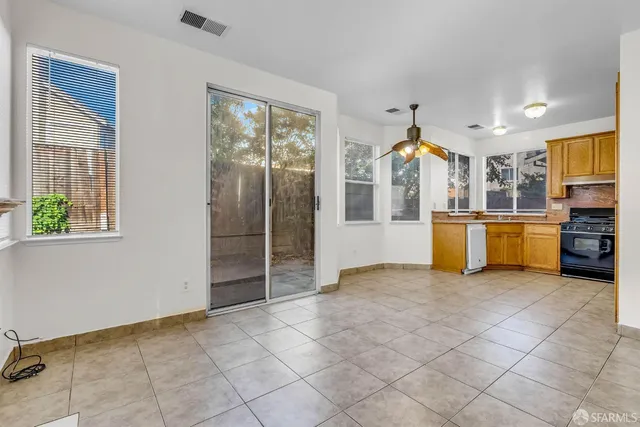 a view of a kitchen with furniture and windows