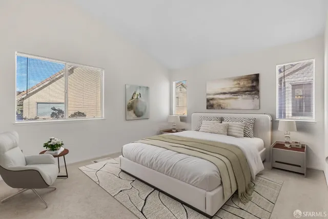 a bedroom with a bed and a couch