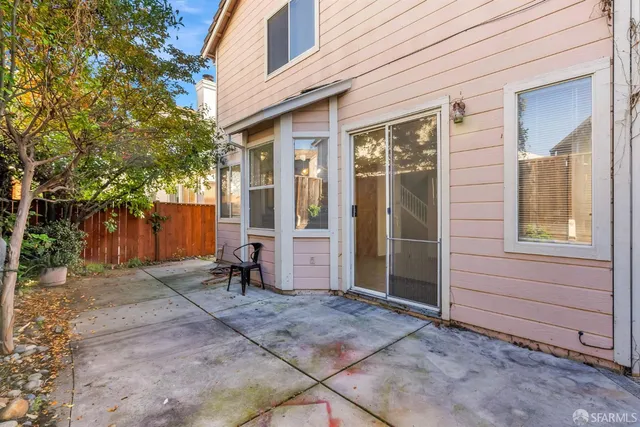 a view of a bench in front of house