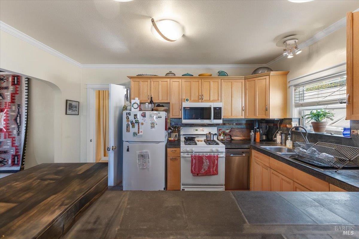 130 11th Street Santa Rosa, CA 95401 - Photo 13 of 50 a kitchen with stainless steel appliances granite countertop a refrigerator stove microwave sink and dishwasher