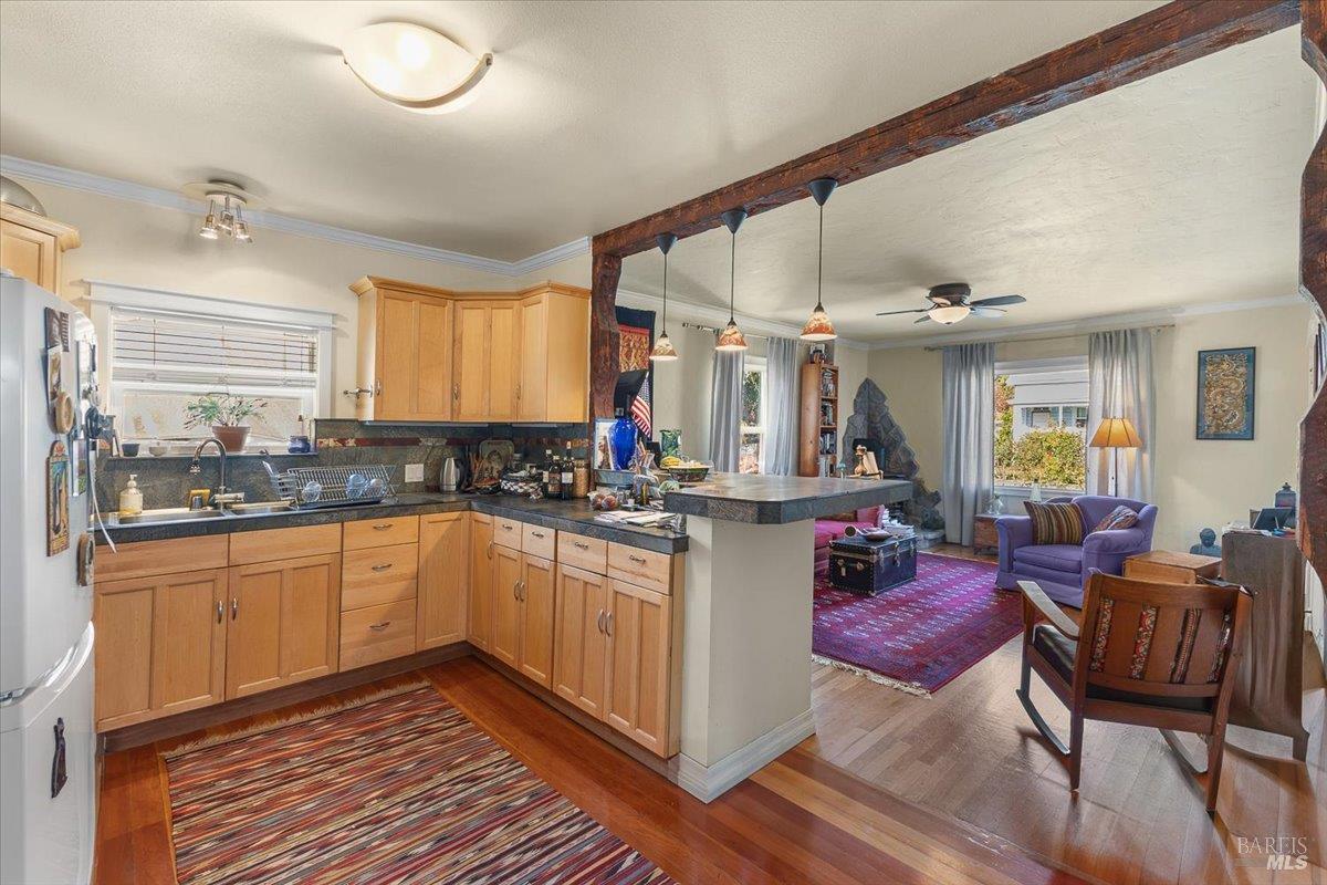 130 11th Street Santa Rosa, CA 95401 - Photo 15 of 50 a kitchen with sink cabinets and dining table