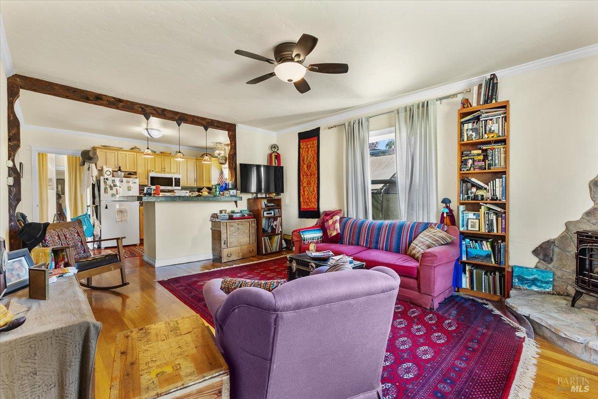 130 11th Street Santa Rosa, CA 95401 - Photo 19 of 50 a living room with furniture fireplace and a large window
