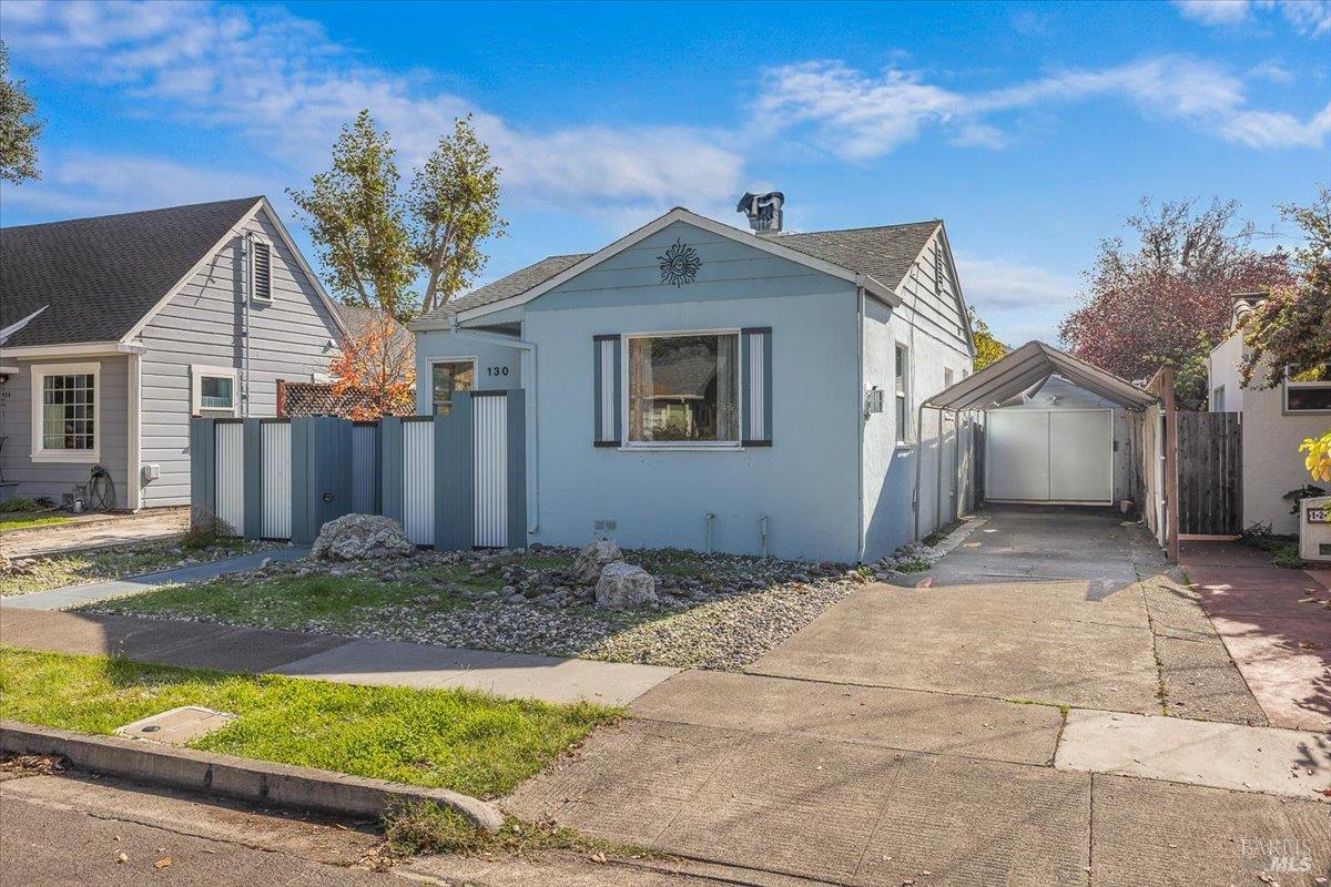 130 11th Street Santa Rosa, CA 95401 - Photo 25 of 50 a front view of a house with a yard and garage