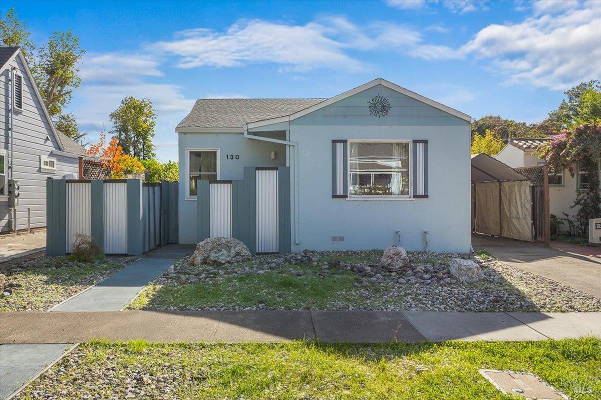 130 11th Street Santa Rosa, CA 95401 - Photo 3 of 50 a front view of a house with a yard
