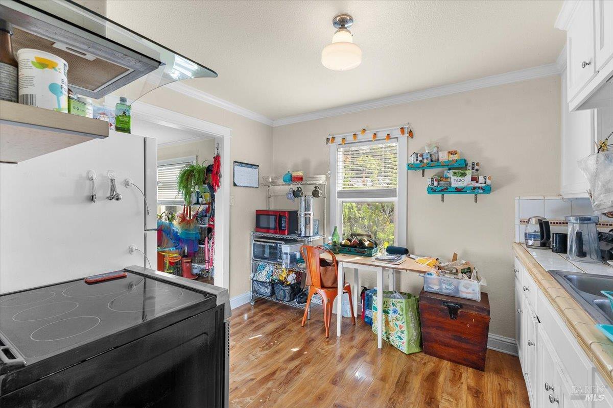 130 11th Street Santa Rosa, CA 95401 - Photo 32 of 50 a storage room with lots of clutter and stainless steel appliances