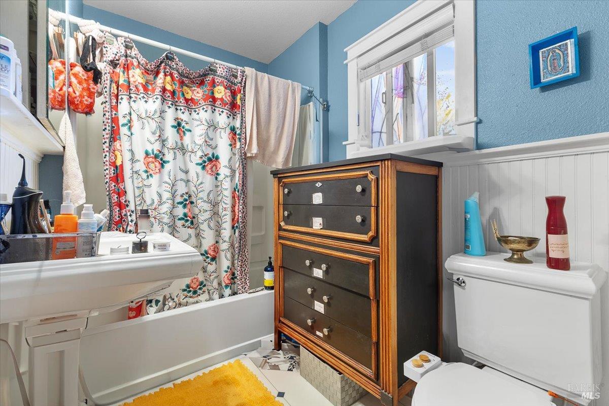 130 11th Street Santa Rosa, CA 95401 - Photo 36 of 50 a bathroom with a sink toilet vanity and window