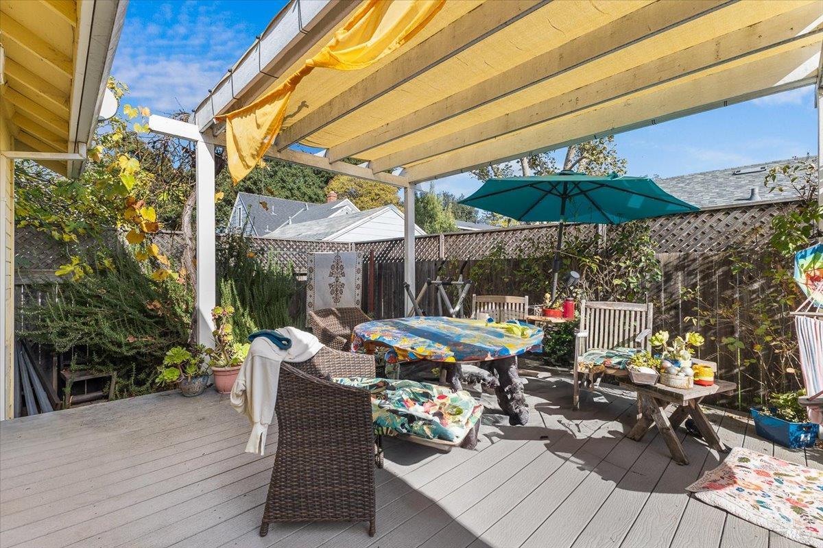 130 11th Street Santa Rosa, CA 95401 - Photo 38 of 50 a view of a patio with table and chairs under an umbrella