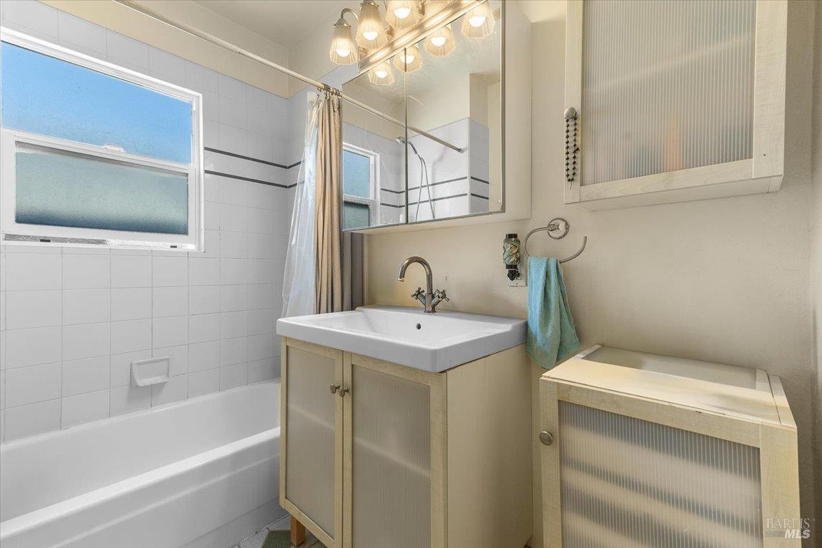 130 11th Street Santa Rosa, CA 95401 - Photo 7 of 50 a bathroom with a sink a toilet and bathtub