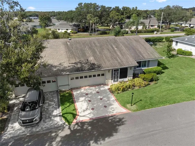 an aerial view of residential house with outdoor space