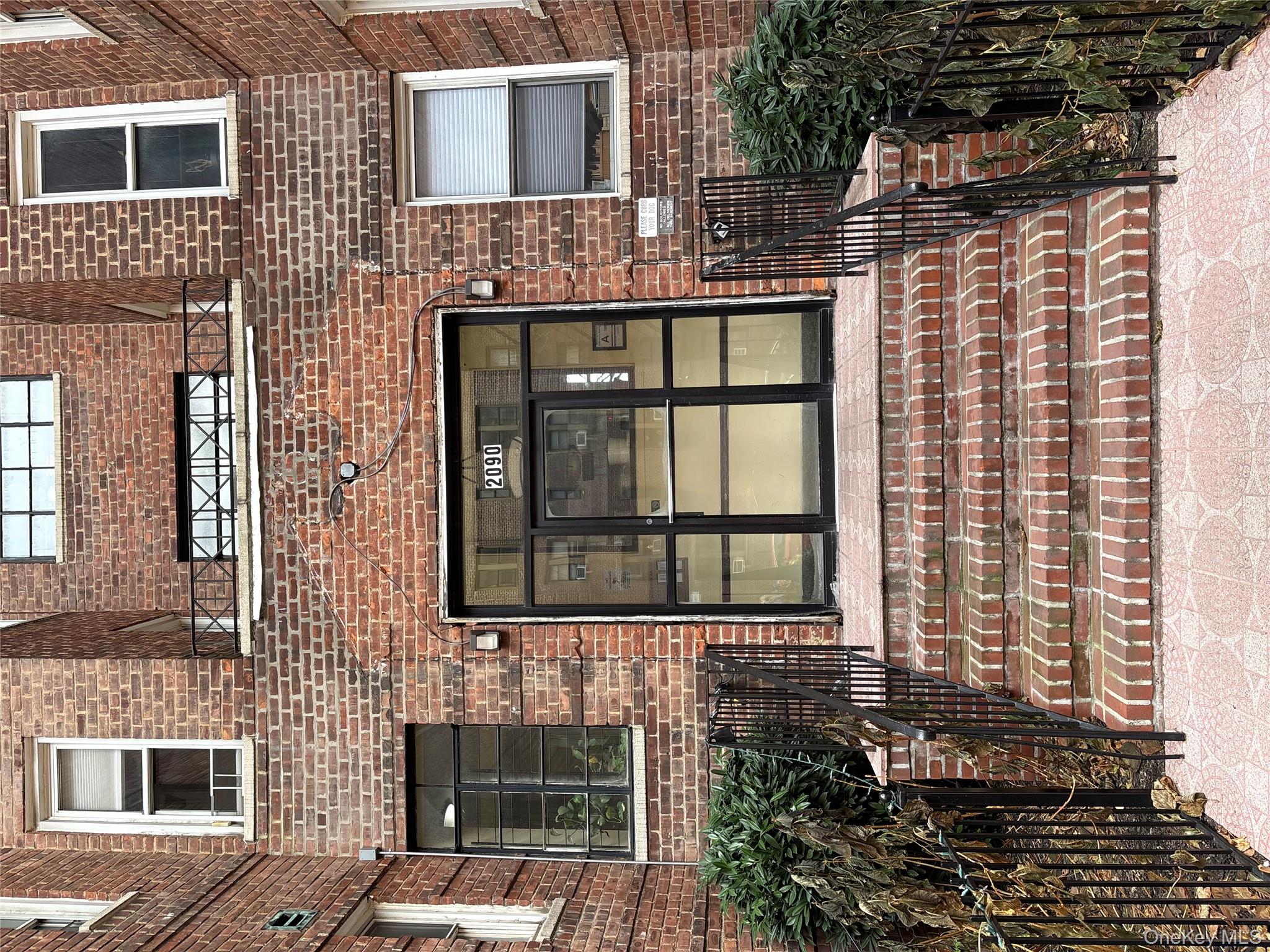 2090 Barnes Avenue, Unit 4D Bronx, NY 10462 - Photo 13 of 14 a front view of a house with a garden