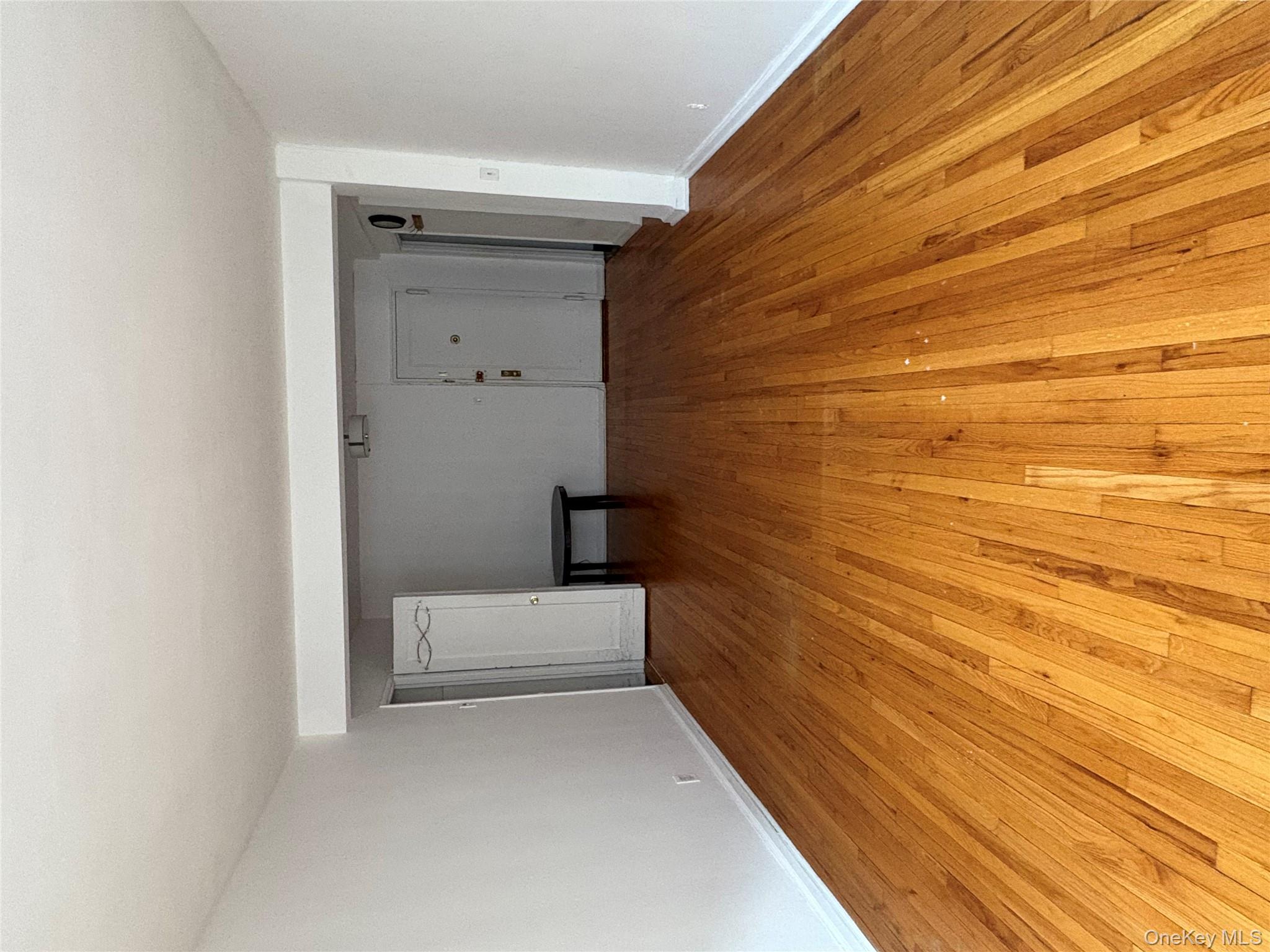 2090 Barnes Avenue, Unit 4D Bronx, NY 10462 - Photo 3 of 14 a view of an empty room with wooden floor