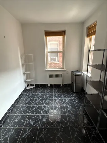 a room with a rug and a window