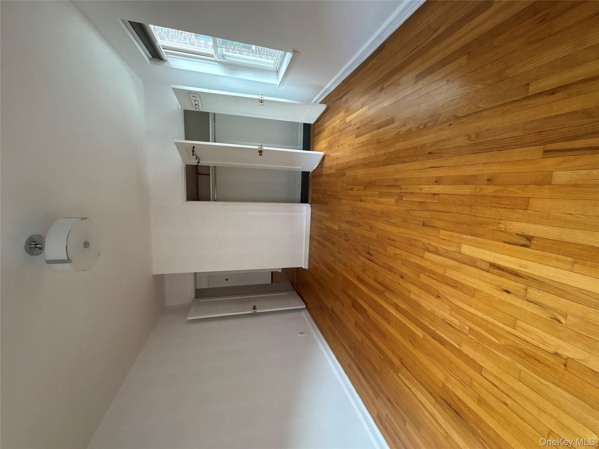 2090 Barnes Avenue, Unit 4D Bronx, NY 10462 - Photo 10 of 14 a view of empty room with wooden floor and fan