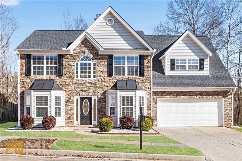 3954 Tristan Way Suwanee, GA 30024 - Photo 1 of 1 a front view of a house with garden