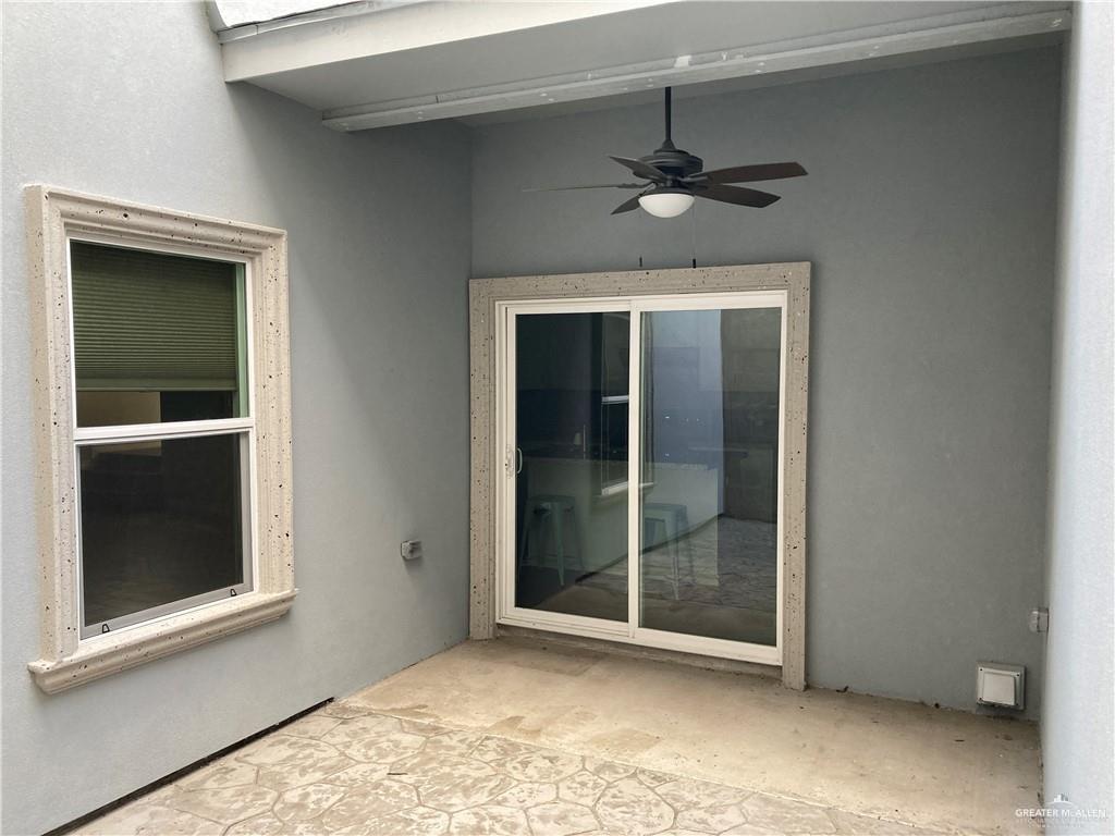 2103 South 6th Street McAllen, TX 78503 - Photo 17 of 33 Property entrance with a patio, a ceiling fan, and stucco siding