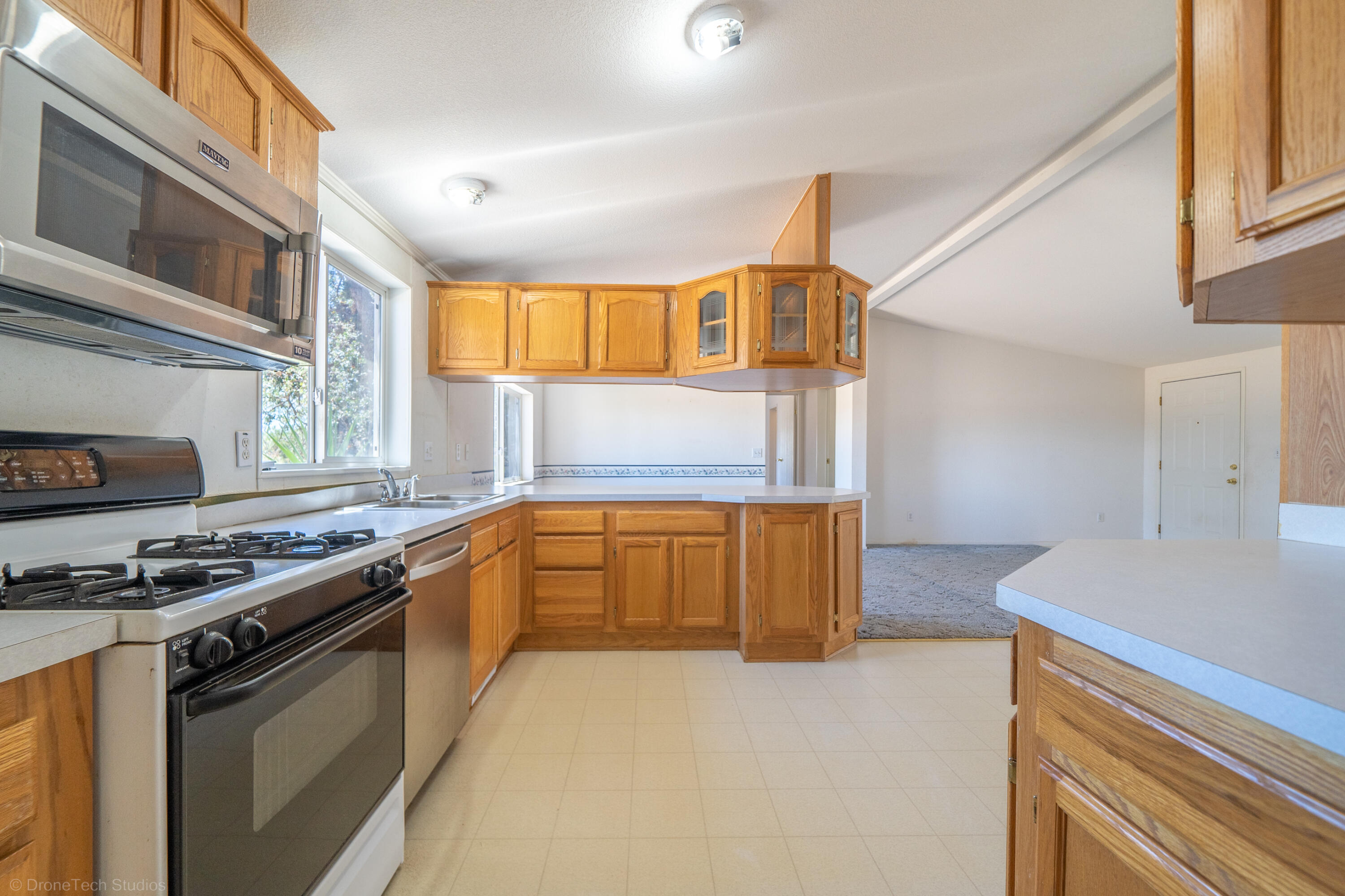 19035 Ridge Road Red Bluff, CA 96080 - Photo 20 of 74 a kitchen with stainless steel appliances granite countertop a stove and a sink