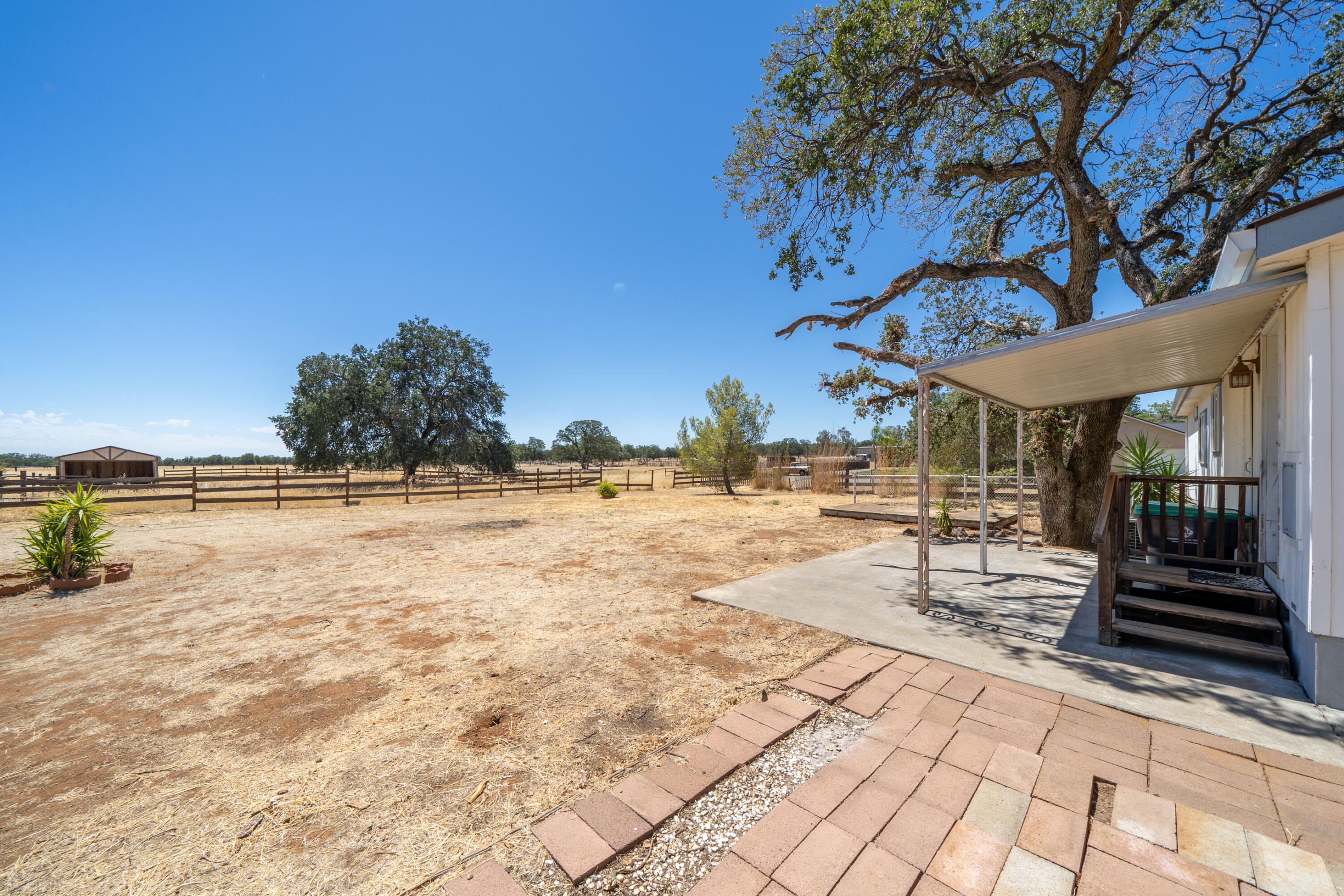 19035 Ridge Road Red Bluff, CA 96080 - Photo 32 of 74 a view of a swimming pool with a patio