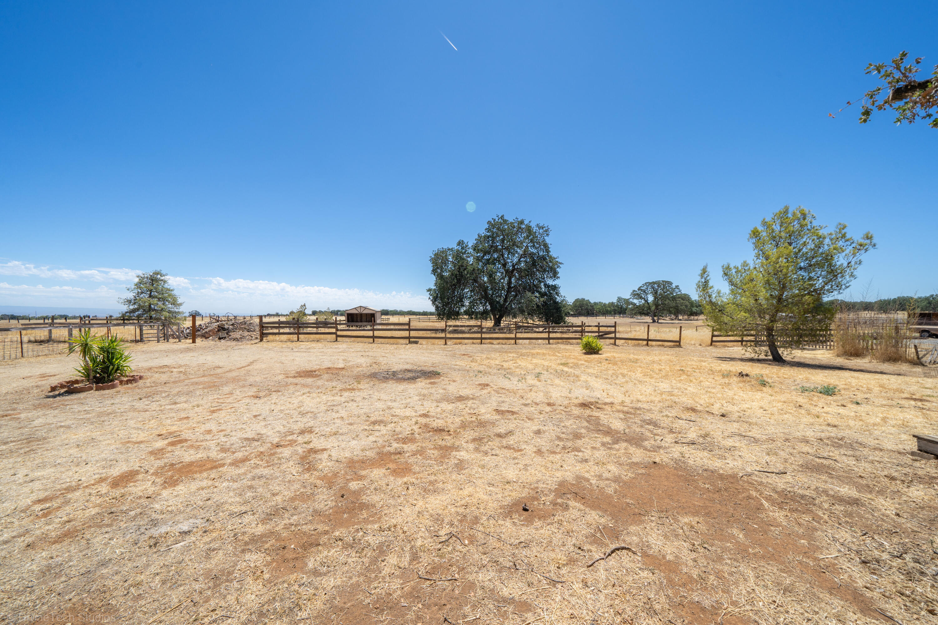 19035 Ridge Road Red Bluff, CA 96080 - Photo 33 of 74 a view of a yard with a house
