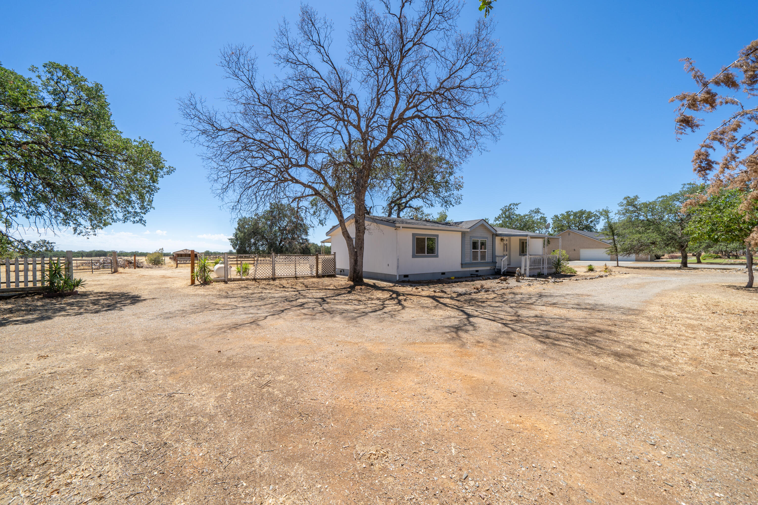 19035 Ridge Road Red Bluff, CA 96080 - Photo 4 of 74 a view of a yard with snow on the road