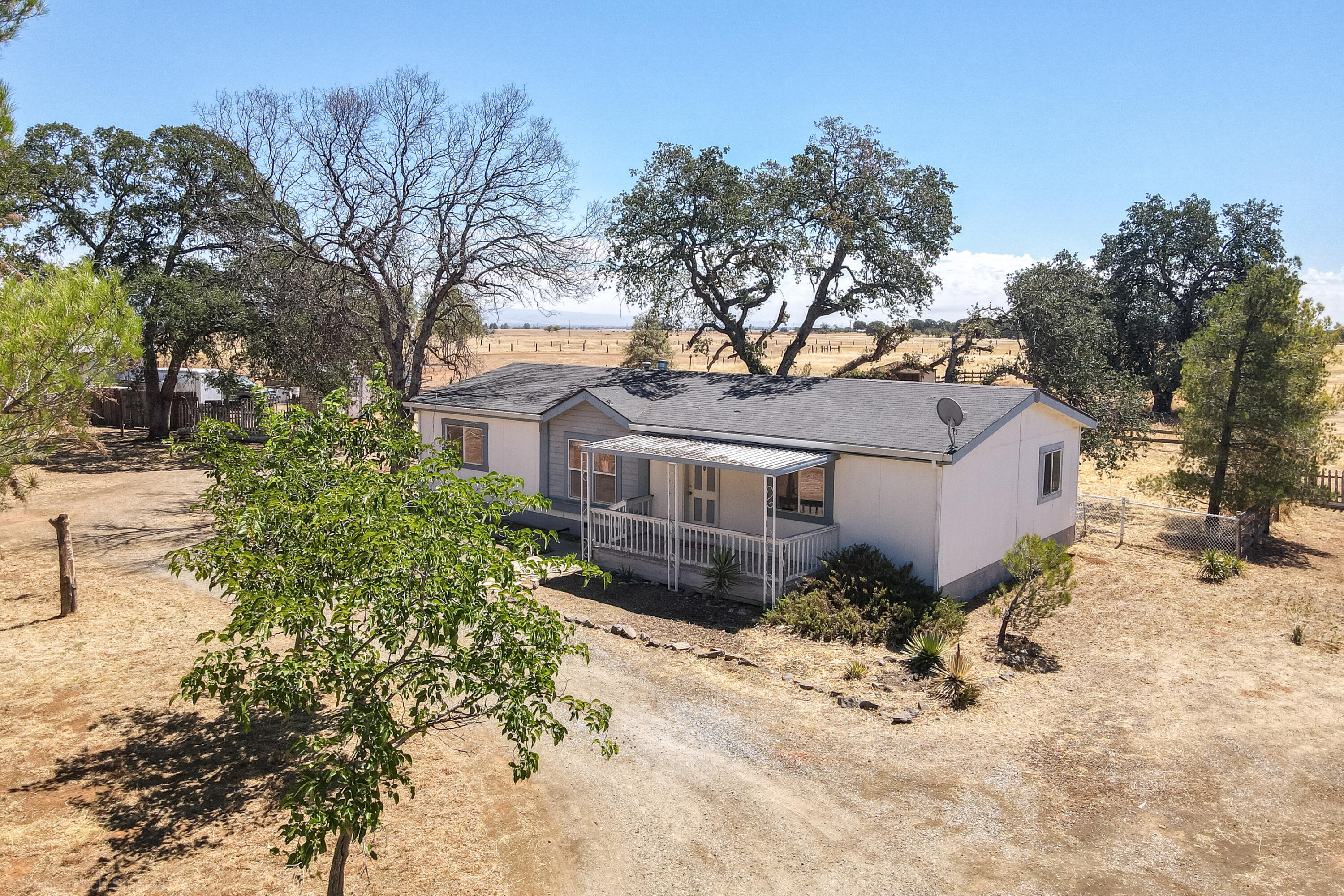 19035 Ridge Road Red Bluff, CA 96080 - Photo 49 of 74 a front view of a house with a yard covered in snow