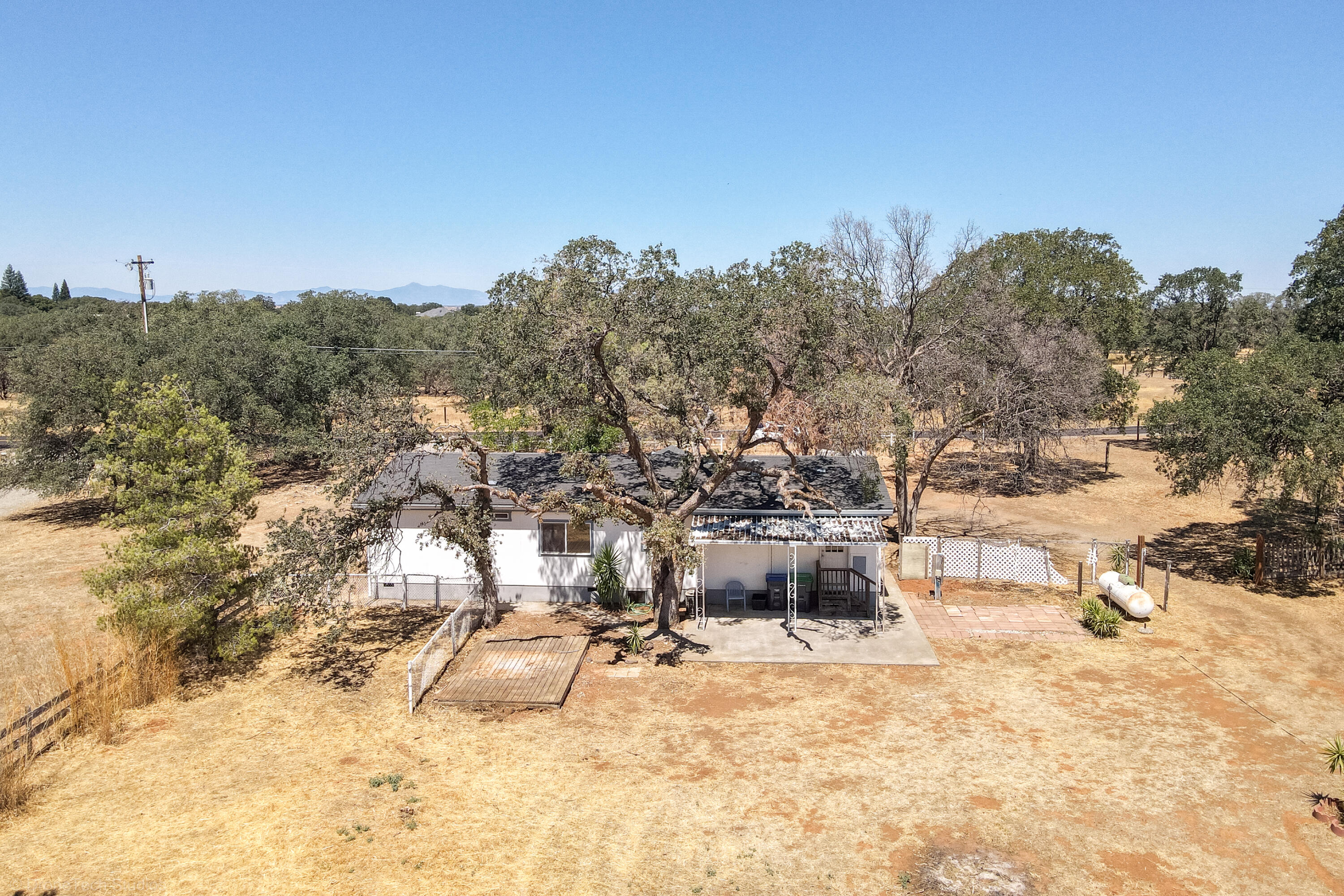 19035 Ridge Road Red Bluff, CA 96080 - Photo 70 of 74 a view of a yard with a tree