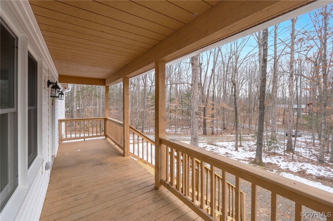 2193 Diggstown Road Bumpass, VA 23024 - Photo 3 of 33 Snow covered deck featuring covered porch