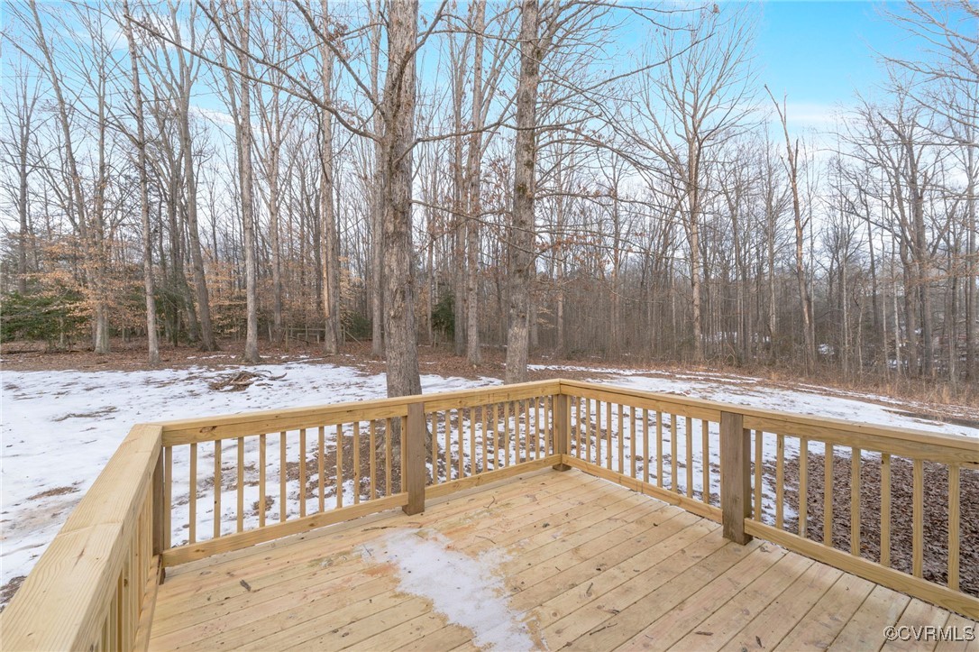 2193 Diggstown Road Bumpass, VA 23024 - Photo 32 of 33 Snow covered deck featuring a wooded view