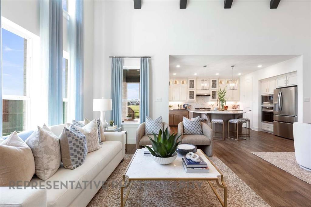 3704 Hickory Street Sherman, TX 75092 - Photo 12 of 23 a living room with furniture wooden floor and a large window