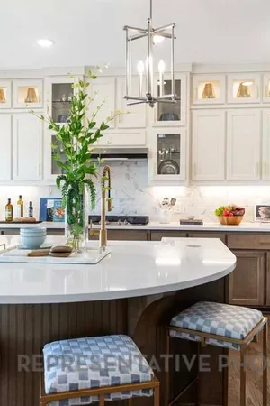 a kitchen with a table and chairs