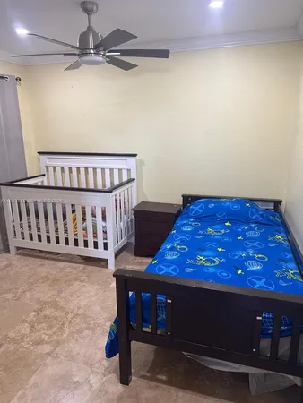 a bedroom with a bed and a table