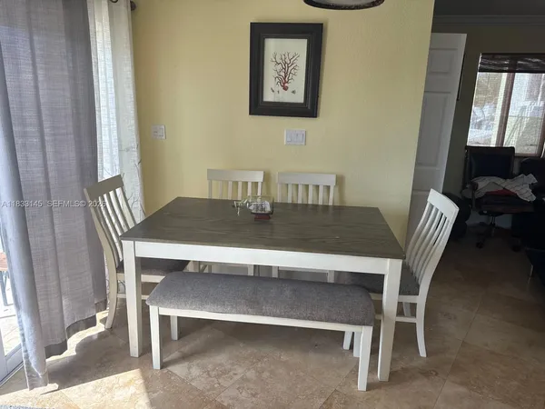 a view of a dining room with furniture