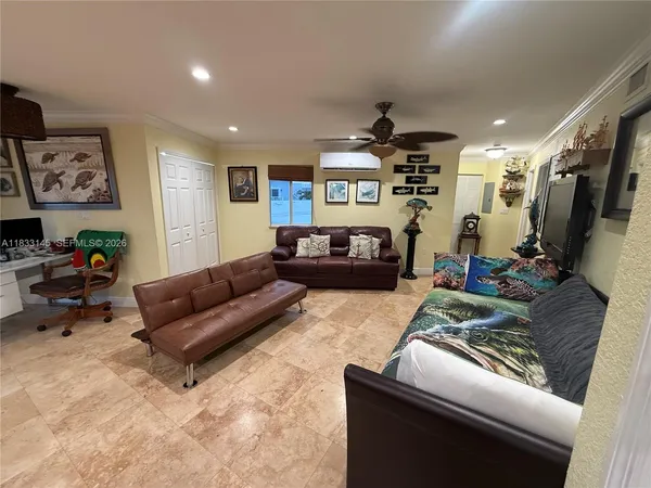 a living room with furniture and a flat screen tv