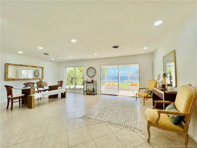a kitchen with granite countertop white cabinets and stainless steel appliances