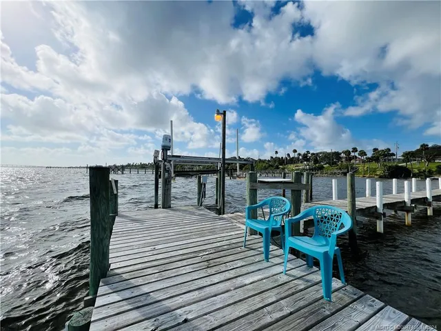 a view of a park with large trees