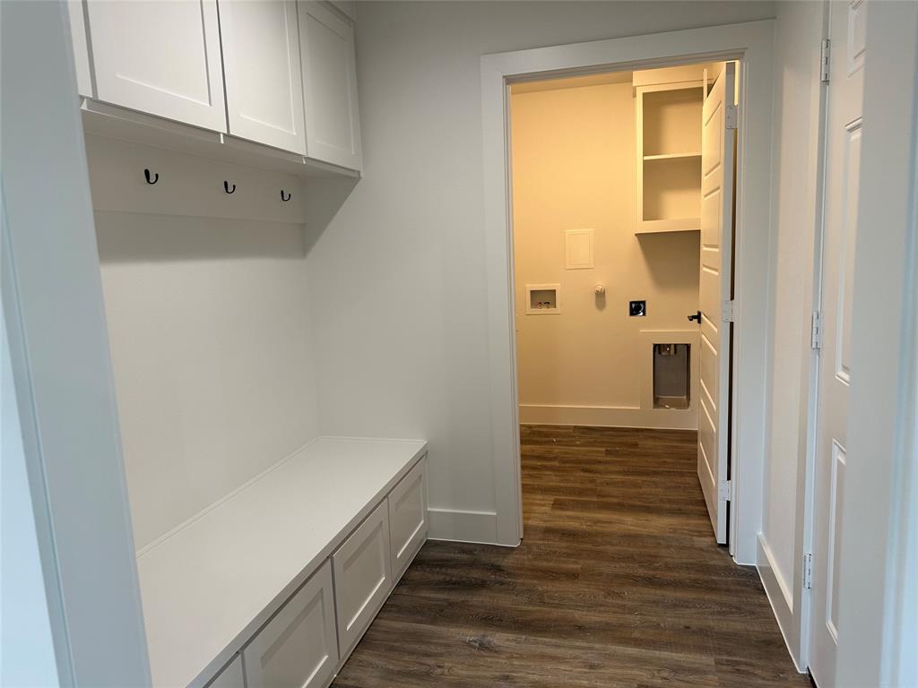803 Sam Houston Street Rockwall, TX 75087 - Photo 6 of 10 Mudroom with dark wood finished floors and baseboards