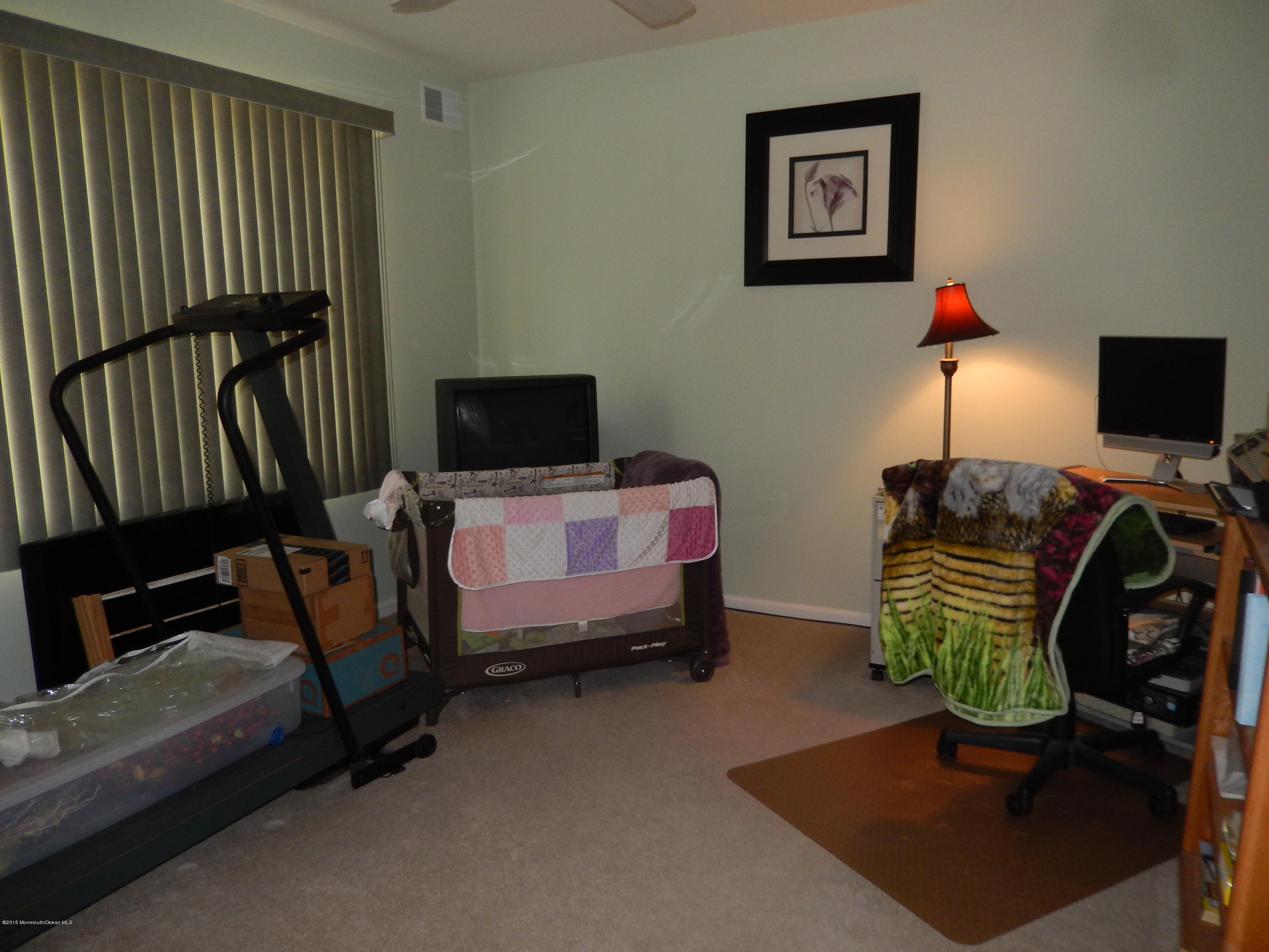 100 Bowsprit Road Manahawkin, NJ 08050 - Photo 13 of 21 a bedroom with furniture and a window