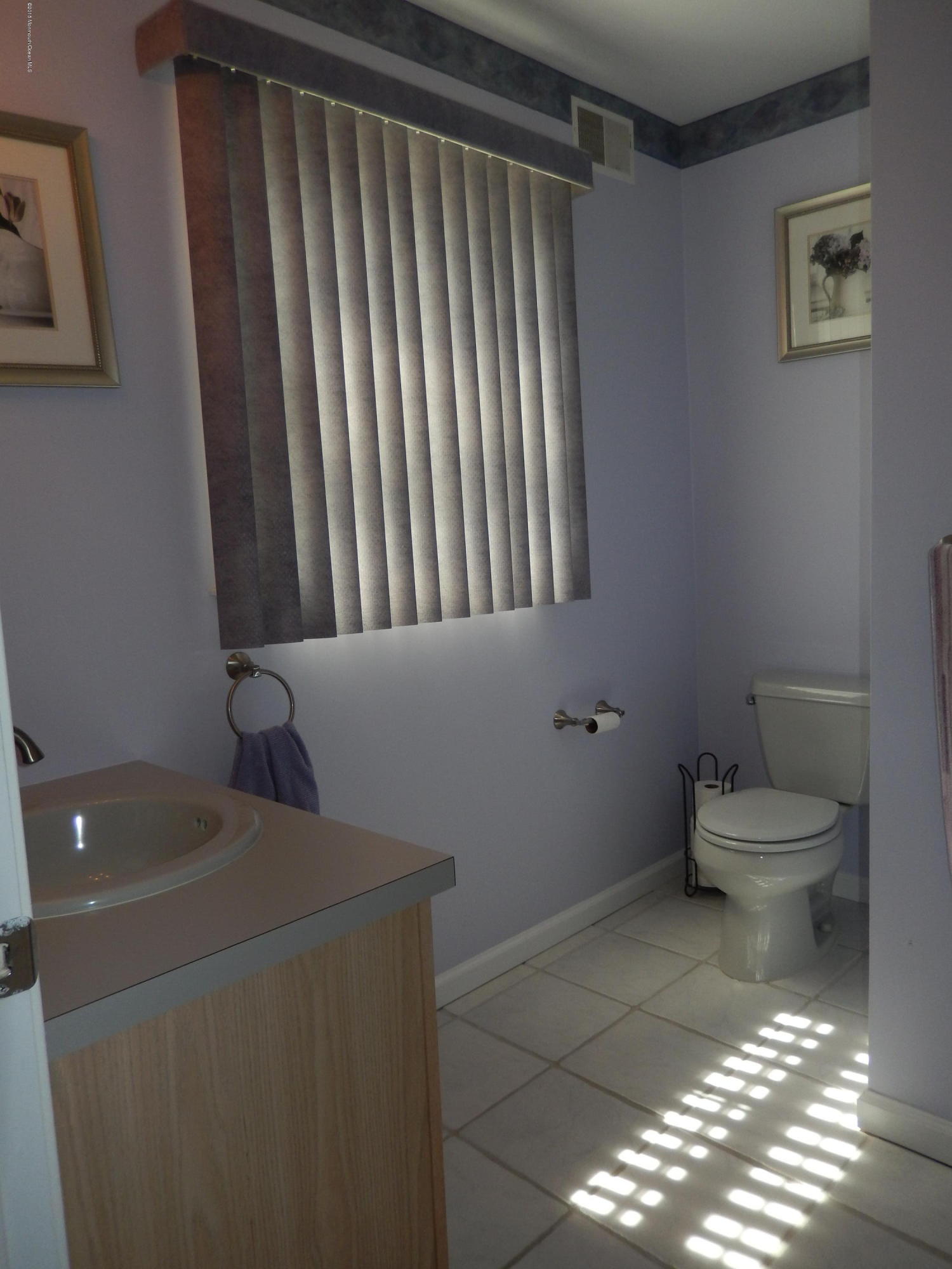 100 Bowsprit Road Manahawkin, NJ 08050 - Photo 17 of 21 a bathroom with a toilet and a sink