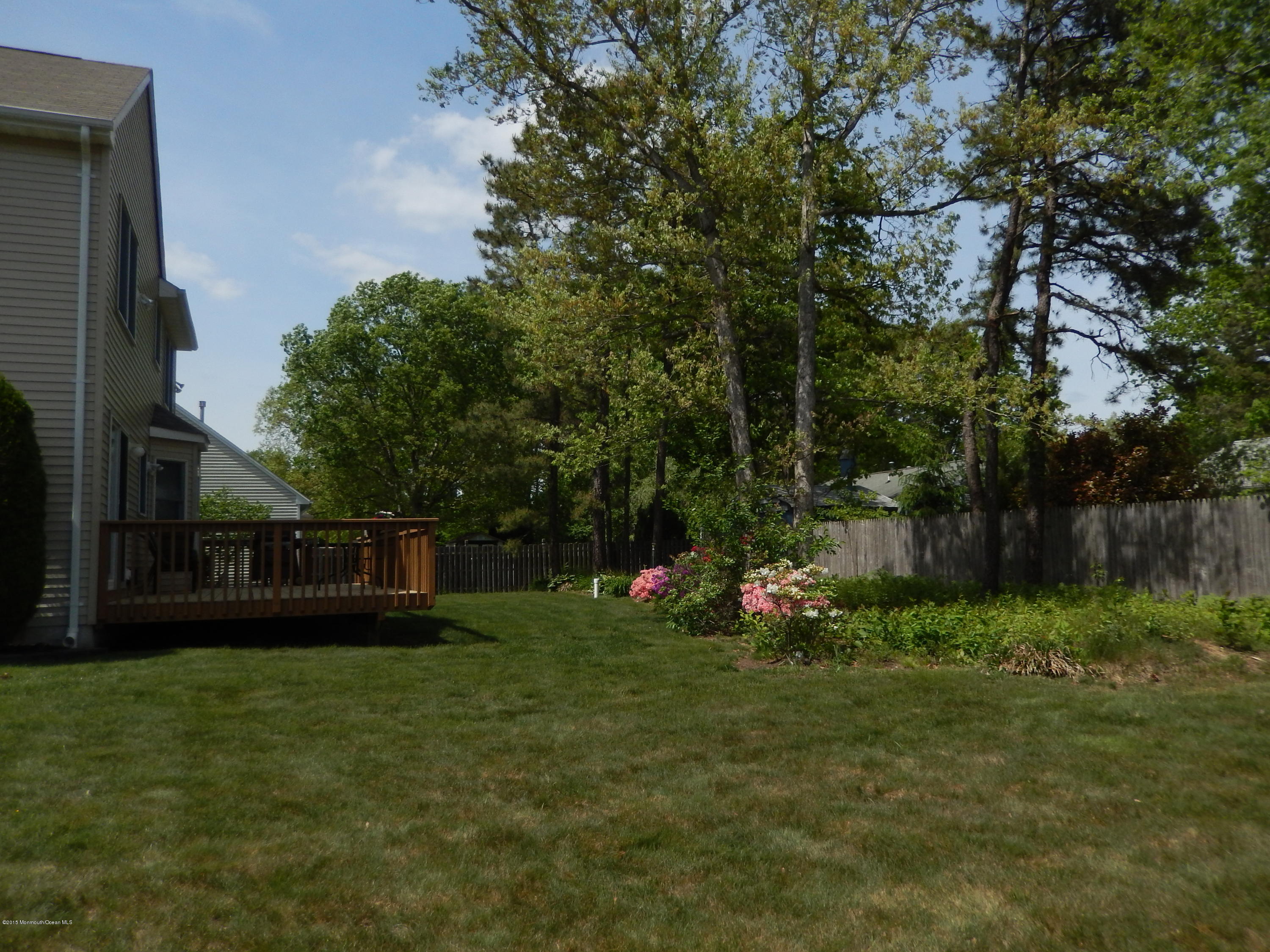 100 Bowsprit Road Manahawkin, NJ 08050 - Photo 18 of 21 a view of a backyard with a small cabin