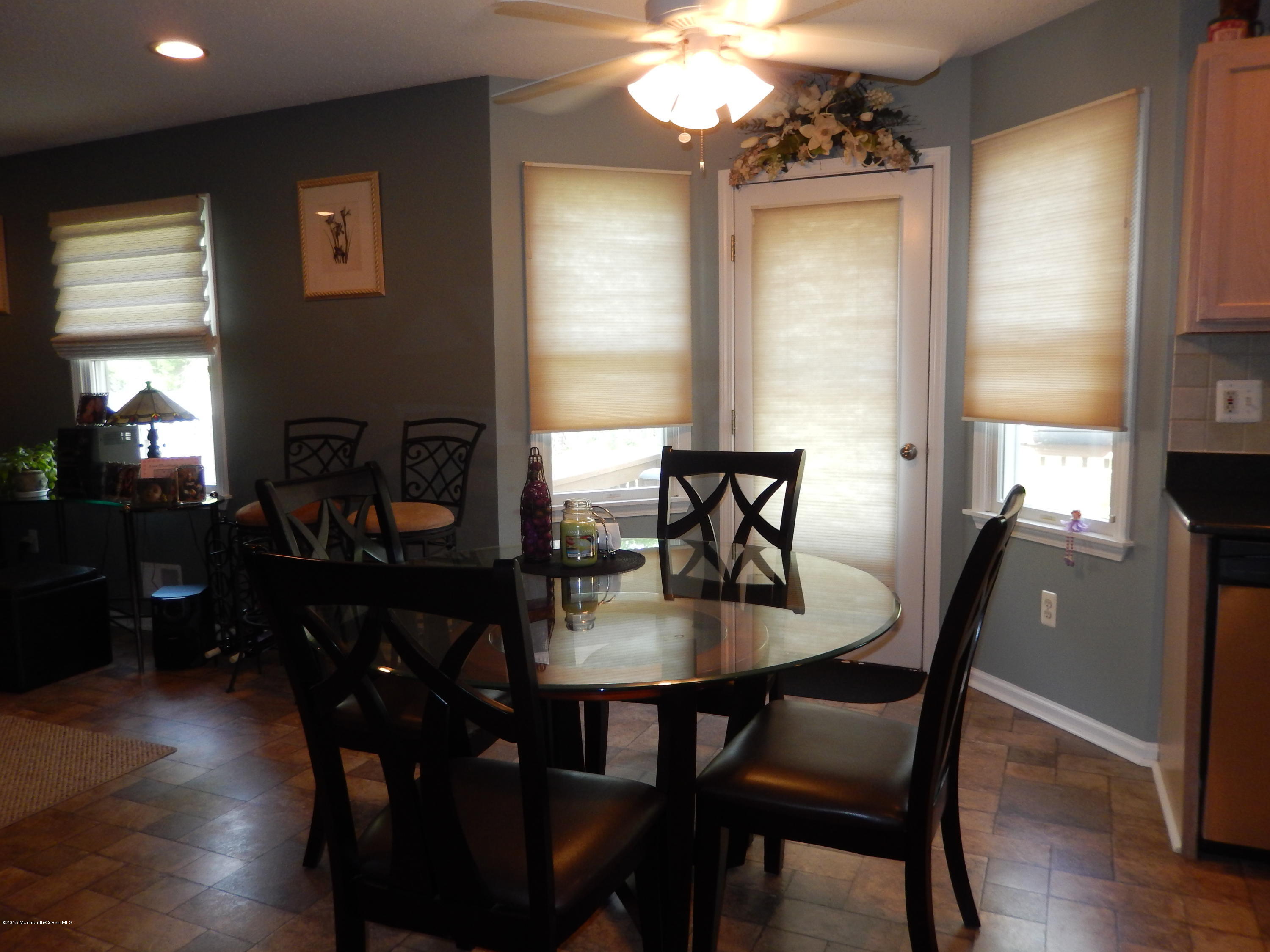 100 Bowsprit Road Manahawkin, NJ 08050 - Photo 7 of 21 a view of a dining room with furniture window and wooden floor