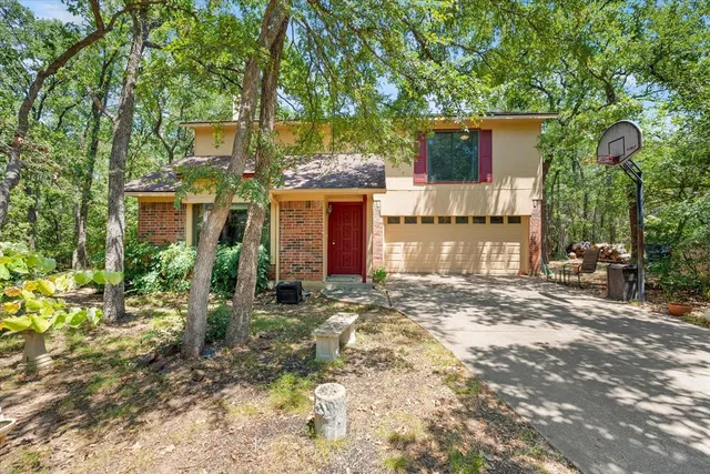 a view of a balcony with wooden floor and fence