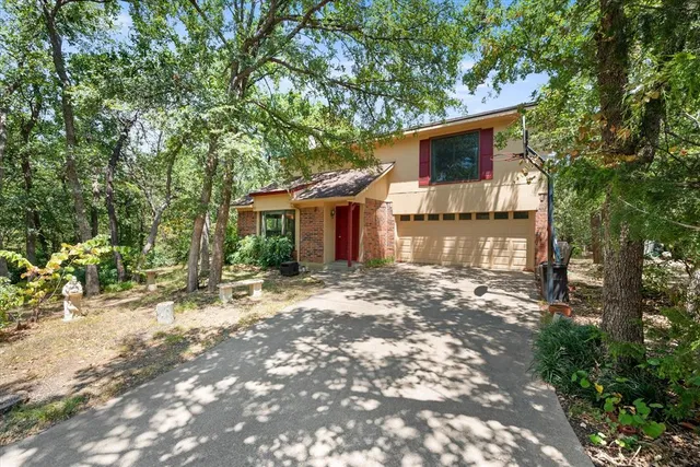 a view of a house with a tree