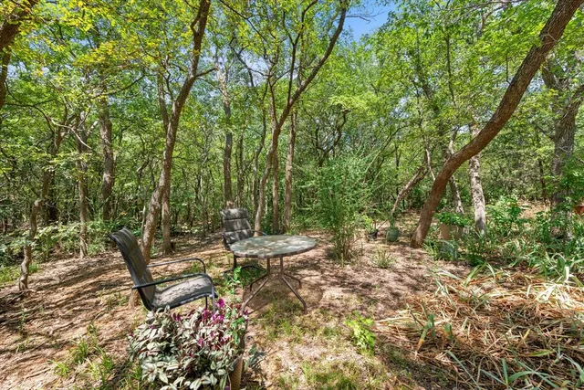 a kitchen with a stove a microwave and wooden cabinets