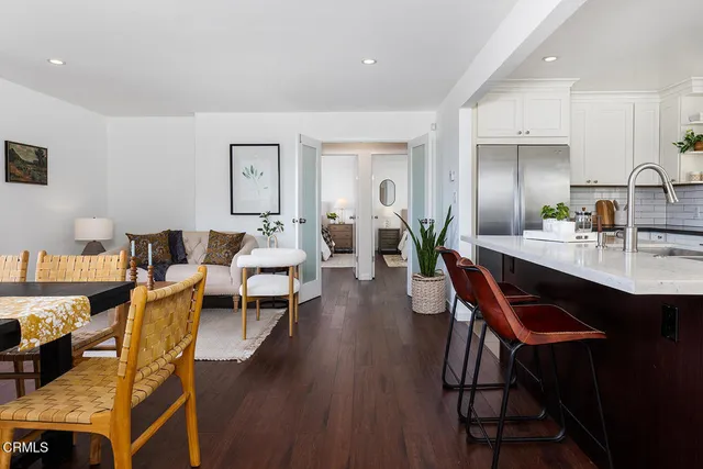 a view of a dining room with furniture and wooden floor