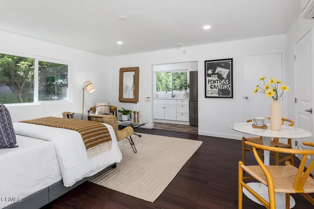 a bed room with a bed and a chair