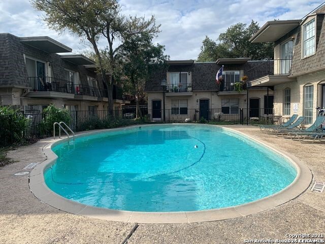 170 De Chantle Road, Unit 502 San Antonio, TX 78201 - Photo 3 of 5 a view of a swimming pool with a patio