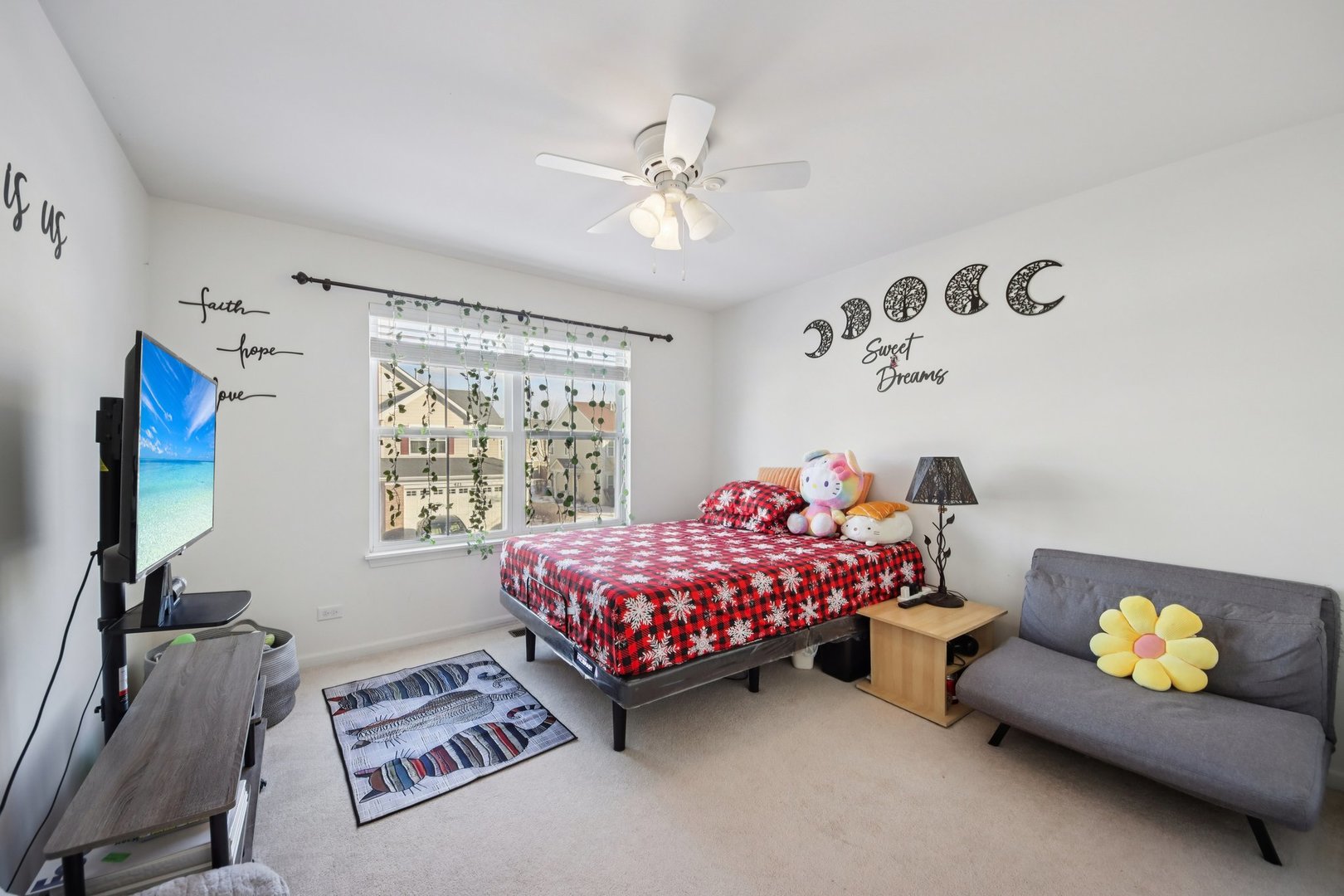 424 Acushnet Street Elgin, IL 60124 - Photo 14 of 21 a bedroom with a bed and a chandelier