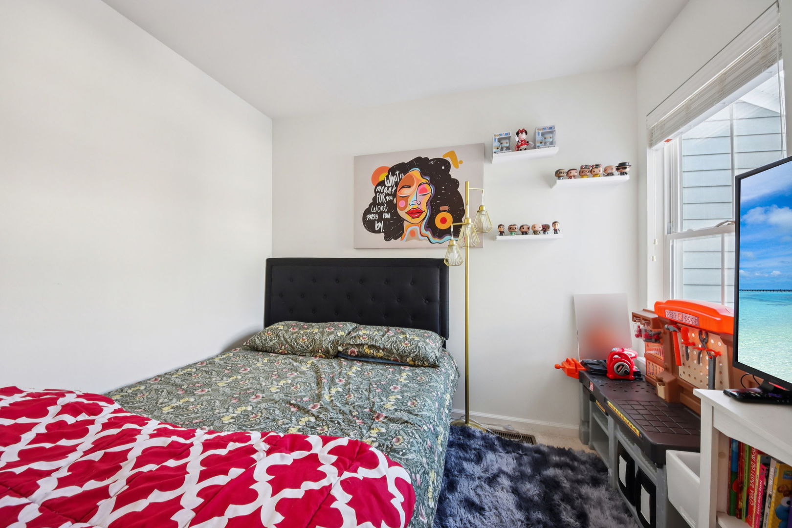 424 Acushnet Street Elgin, IL 60124 - Photo 16 of 21 a bedroom with a bed and a book shelf