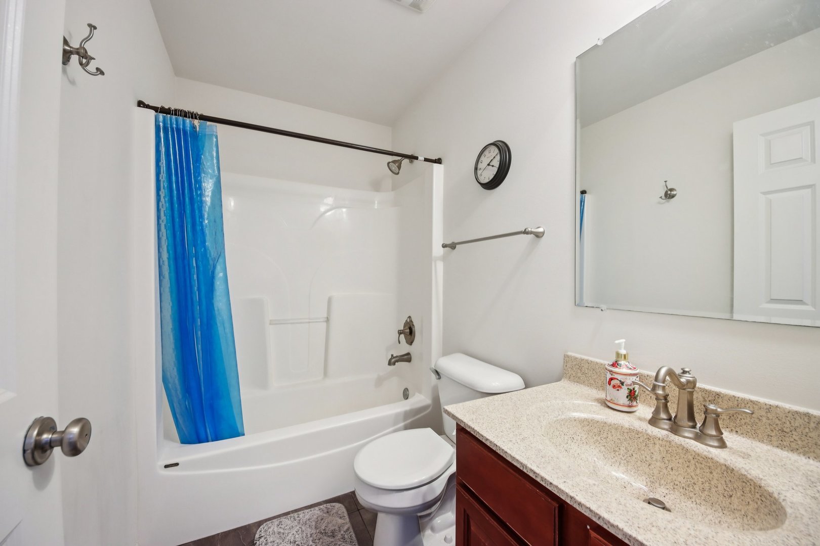 424 Acushnet Street Elgin, IL 60124 - Photo 17 of 21 a bathroom with a sink toilet a mirror and shower